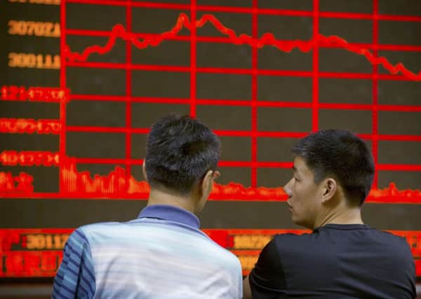 Is China's economic downturn a mere blip, or are we on the brink of a full-scale crisis? Picture: AP