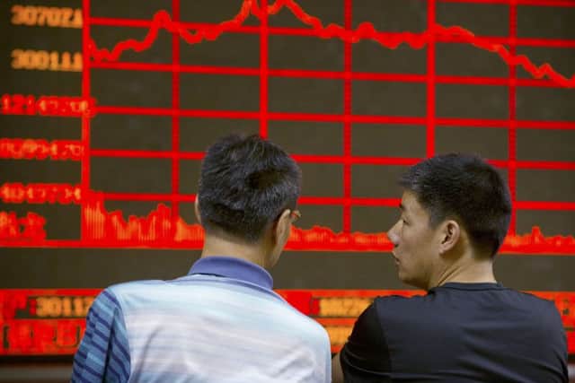 Is China's economic downturn a mere blip, or are we on the brink of a full-scale crisis? Picture: AP