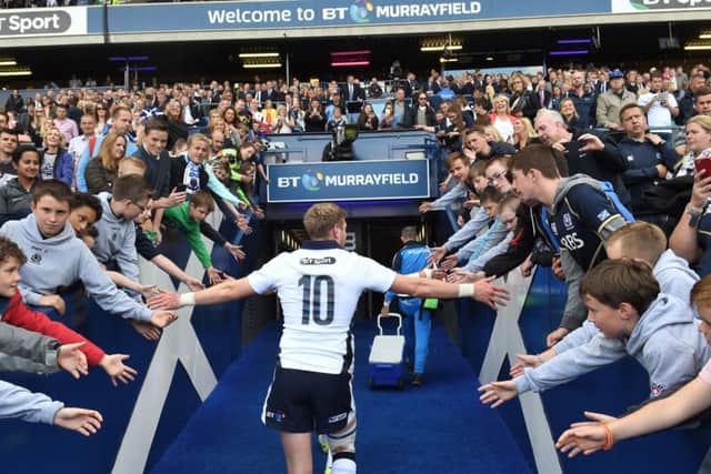 Finn Russell connects with young fans at full-time. Picture: SNS/SRU