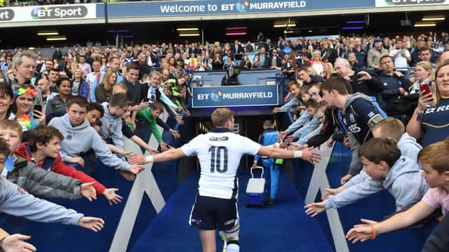 Finn Russell connects with young fans at full-time. Picture: SNS/SRU
