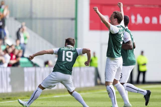 James Keatings, left, celebrates after his debut goal gave Hibernian the lead. Picture: SNS