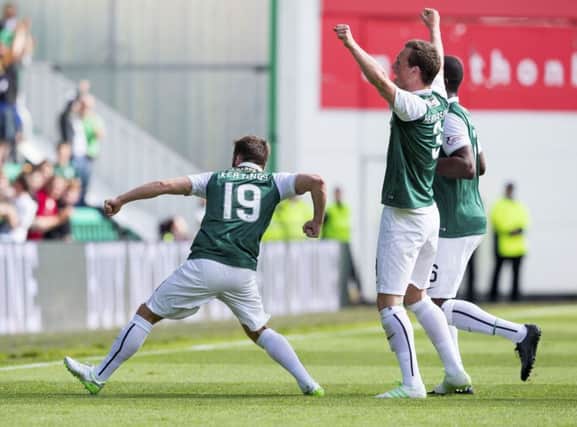 James Keatings, left, celebrates after his debut goal gave Hibernian the lead. Picture: SNS