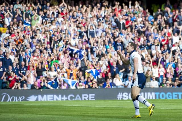 Tim Visser celebrates scoring his second try of the game against Italy at BT Murrayfield on Saturday. Picture: SNS/SRU