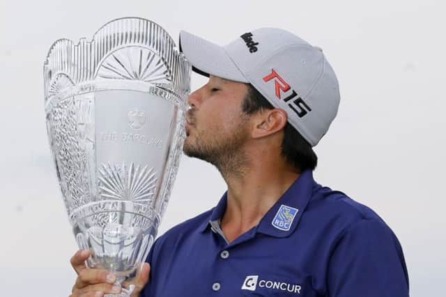 Jason Day kisses the trophy after winning The Barclays in New Jersey last Sunday. Picture: AP