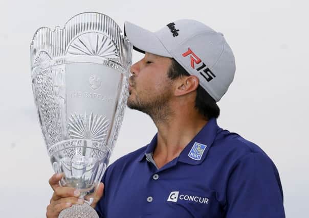 Jason Day kisses the trophy after winning The Barclays in New Jersey last Sunday. Picture: AP