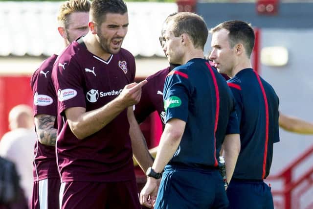 Hearts' Alim Ozturk (second from left) complains to officials at full time after their 3-2 defeat to Hamilton. Picture: SNS Group