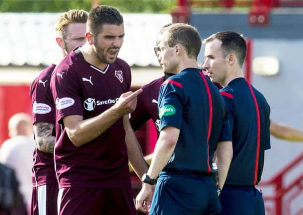 Hearts' Alim Ozturk (second from left) complains to officials at full time after their 3-2 defeat to Hamilton. Picture: SNS Group