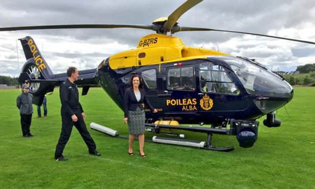 Tasmina Ahmed-Sheikh beside the Police Scotland helicopter. Picture: Twitter