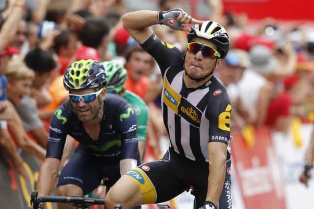 Kristian Sbaragli salutes the crowd as he crosses the finishing line in first place. Picture:Jose Jordan/AFP/Getty