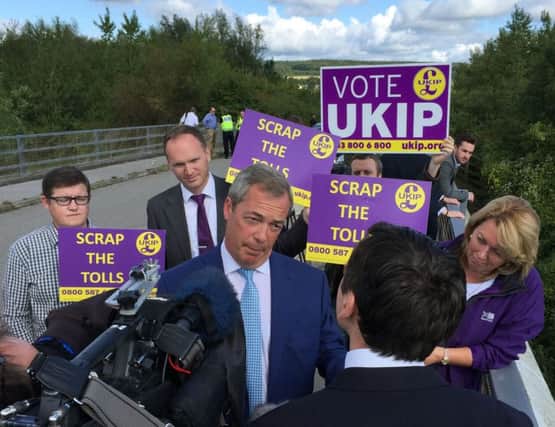 Ukip leader Nigel Farage addresses supporters and the media on a bridge overlooking the Severn Tolls on the M4. Picture: PA