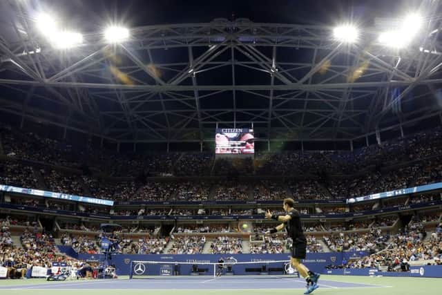 Andy Murray returns a shot under the lights in New York. Picture: AP