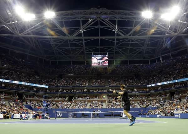 Andy Murray returns a shot under the lights in New York. Picture: AP