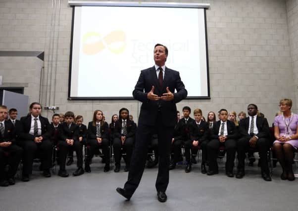 Cameron addresses a school assembly in Corby, Northamptonshire, yesterday. Picture: Getty