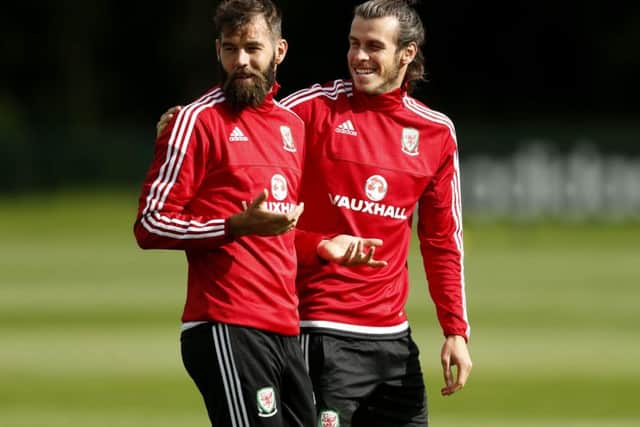 Gareth Bale looks relaxed in training alongside former Celtic midfielder Joe Ledley. Picture: Paul Harding/PA