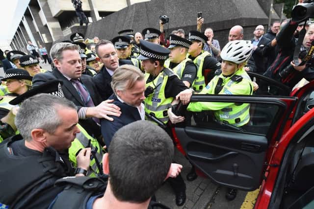 Craig Whyte leaves court surrounded by police on September 2, 2015 in Glasgow. Picture: Getty Images