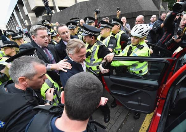 Craig Whyte leaves court surrounded by police on September 2, 2015 in Glasgow. Picture: Getty Images