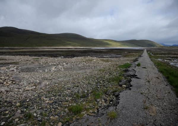Water levels have dropped low enough in Loch Glascarnoch to reveal a former road and bridges that connected Inverness and Ullapool. Picture: Hemedia
