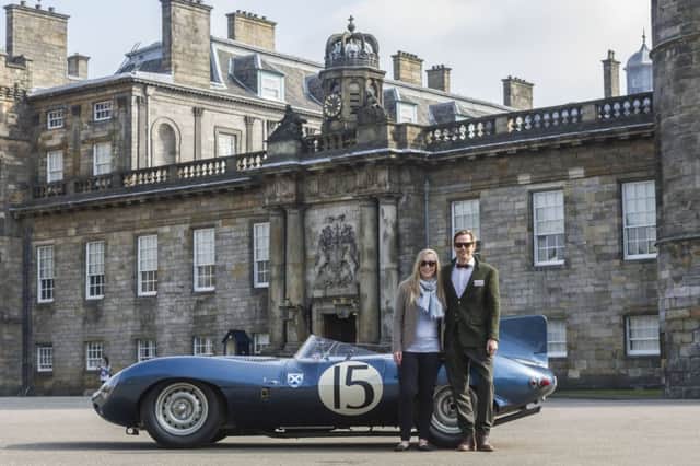 Car enthusiasts Chloe Gammie and Mark Hogarth pose with a Jaguar D-type 1956 Ecurie Ecosse racing car at the Palace of Holyroodhouse. Picture: Steven Scott Taylor/JP