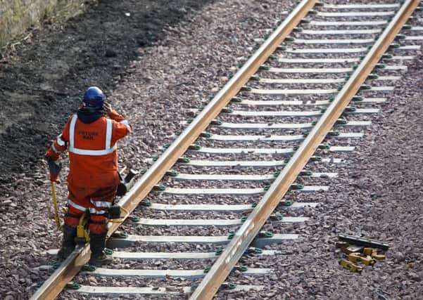 A workman on the new track. Picture: Scott Louden