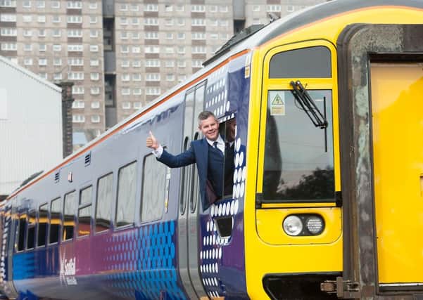 Minister for Transport Derek Mackay with one of the first new-look trains due to be on the tracks for the reopening of the Borders Railway this weekend. Picture: John Devlin