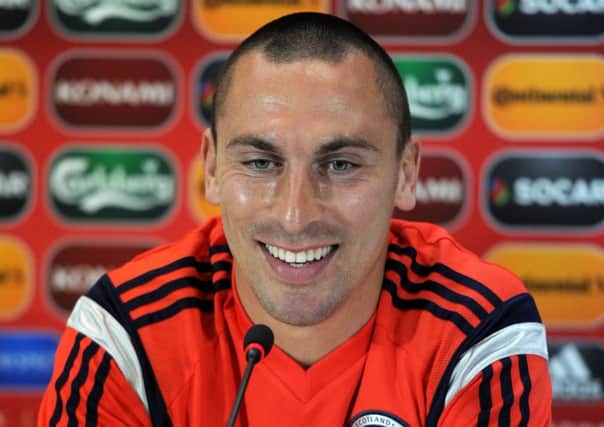 Scotland captain Scott Brown is all smiles in Tbilisi yesterday. Picture: Vano Shlamov/AFP/Getty Images