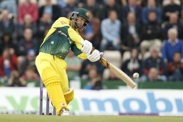 Australia's Matthew Wade smashes a boundary. Picture: Alastair Grant/AP