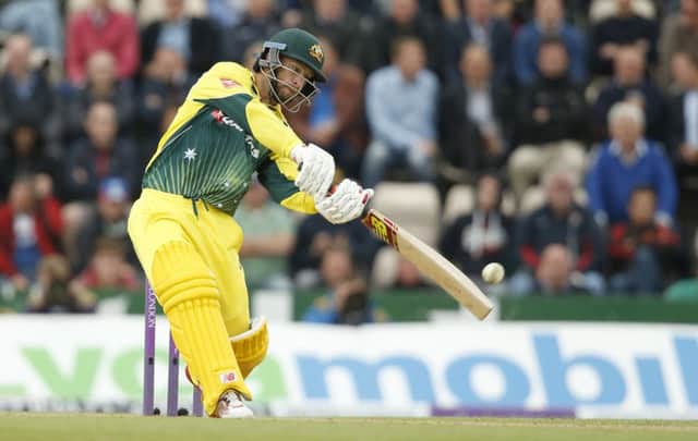 Australia's Matthew Wade smashes a boundary. Picture: Alastair Grant/AP