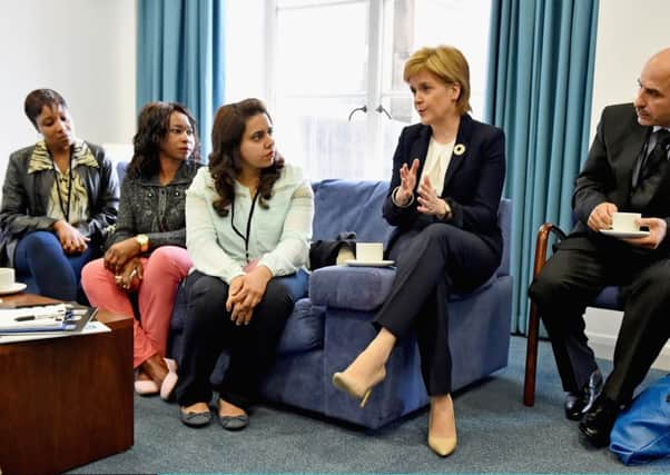 First Minister Nicola Sturgeon meets with representative from refugee community during a humanitarian summit at St Andrew's House in Edinburgh. Picture: Getty Images