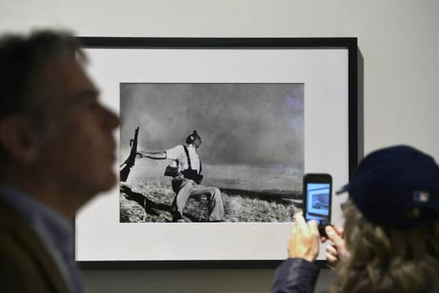 Robert Capa's picture of The Falling Soldier retains its power despite now being the stuff of exhibitions. Picture: AFP/Getty