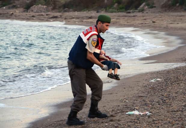 The news photo of Aylan Kurdi used by The Scotsman presented a disturbing reality while seeking not to offend. Pictures: AP
