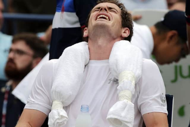 Andy Murray cools off with ice wrapped around his neck during his win over Adrian Mannarino. Picture: AP