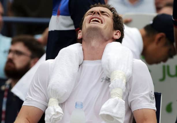 Andy Murray cools off with ice wrapped around his neck during his win over Adrian Mannarino. Picture: AP
