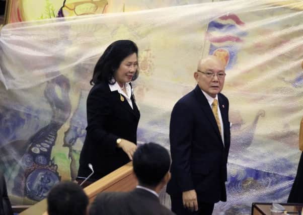 Thienchai Kiranan, right, president of Thailand's legislature, the National Reform Council. Picture: AP