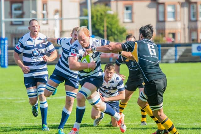 Jason Hill, trying to break through the tackle of Travis Brooke, was hugely influential for Heriot's. Picture: Ian Georgeson