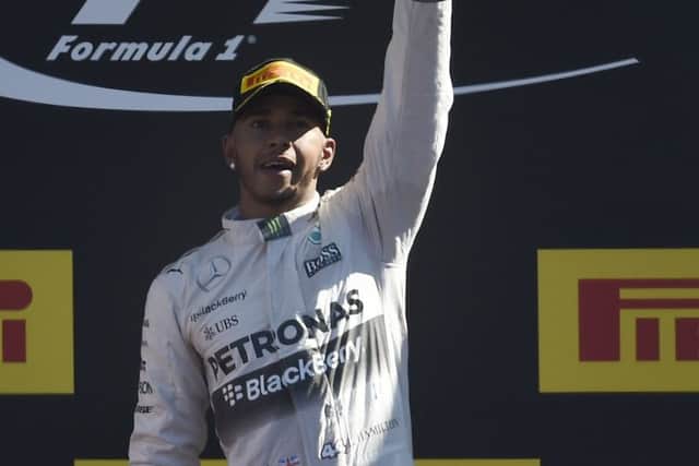 Lewis Hamilton celebrates on the podium after his victory at Monza. Picture: Getty