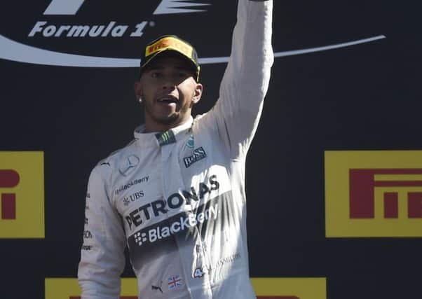 Lewis Hamilton celebrates on the podium after his victory at Monza. Picture: Getty