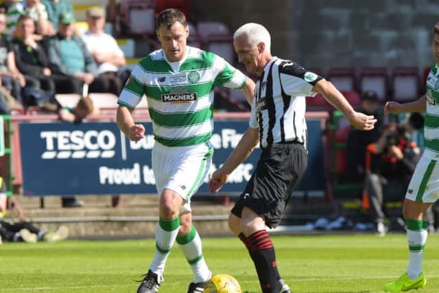 Celtic legend Chris Sutton closes down Pars' Hamish French. Picture: SNS