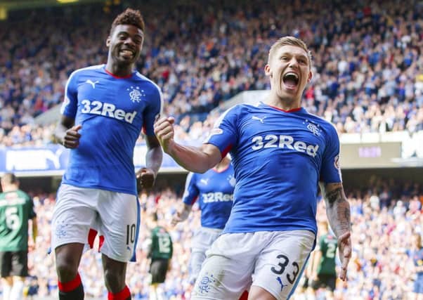 Striker Martyn Waghorn celebrates his first goal from the penalty spot to give Rangers a 4-0 lead over Raith Rovers. Picture: SNS