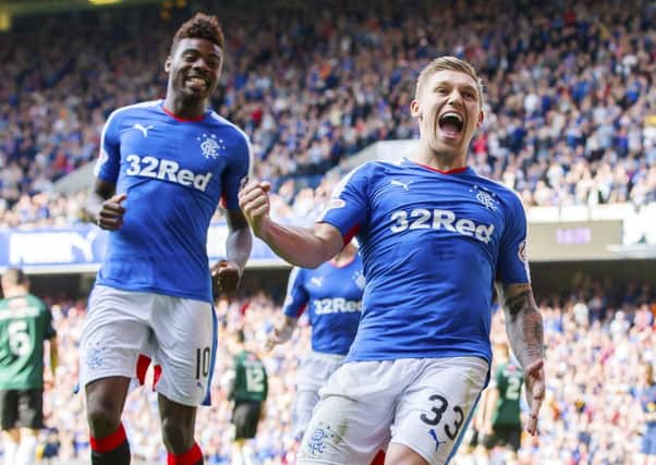 Striker Martyn Waghorn celebrates his first goal from the penalty spot to give Rangers a 4-0 lead over Raith Rovers. Picture: SNS
