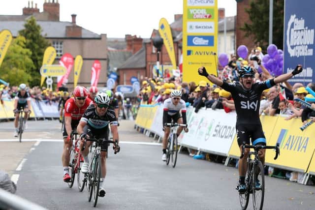 Team Sky's Elia Viviani, right, wins the first stage of the Tour of Britain in Wrexham ahead of Mark Cavendish, left, and Andre Greipel. Picture: PA