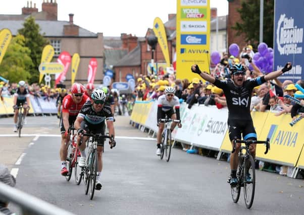 Team Sky's Elia Viviani, right, wins the first stage of the Tour of Britain in Wrexham ahead of Mark Cavendish, left, and Andre Greipel. Picture: PA