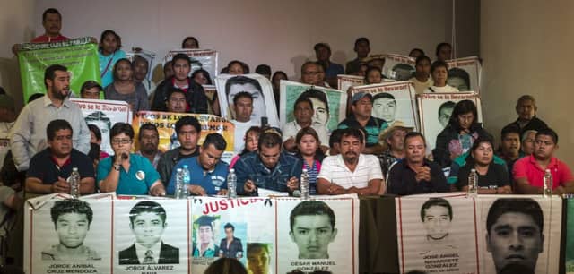 Parents of the missing students at the unveiling of the independent report which poured scorn on the official version of events. Picture: Getty