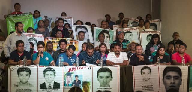 Parents of the missing students at the unveiling of the independent report which poured scorn on the official version of events. Picture: Getty