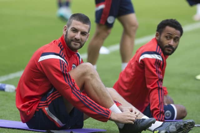 Scotland's Charlie Mulgrew (left) and Ikechi Anya during a training session at Hampden Park. Picture: PA