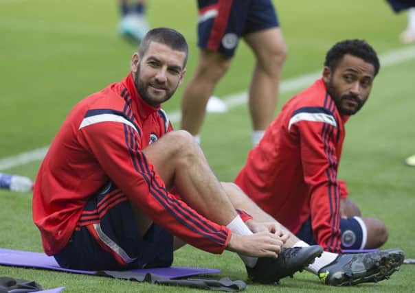 Scotland's Charlie Mulgrew (left) and Ikechi Anya during a training session at Hampden Park. Picture: PA