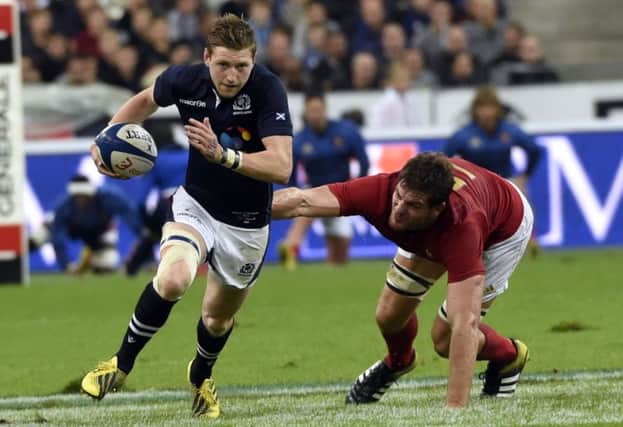 Finn Russell, evading French lock Alexandre Flanquart, says the Scots warm-up displays were encouraging. Picture: AFP/Getty
