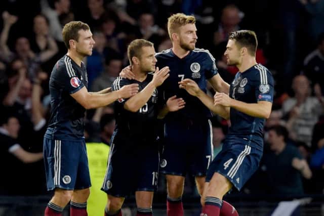 Shaun Maloney (2nd left) celebrates helping to level the score at Hampden. Picture: SNS
