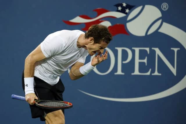 Andy Murray feels the strain during his four-set loss to Kevin Anderson. Picture: AP