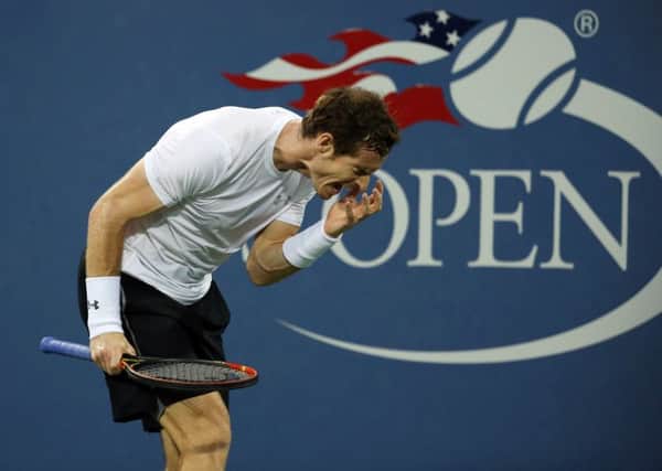 Andy Murray feels the strain during his four-set loss to Kevin Anderson. Picture: AP