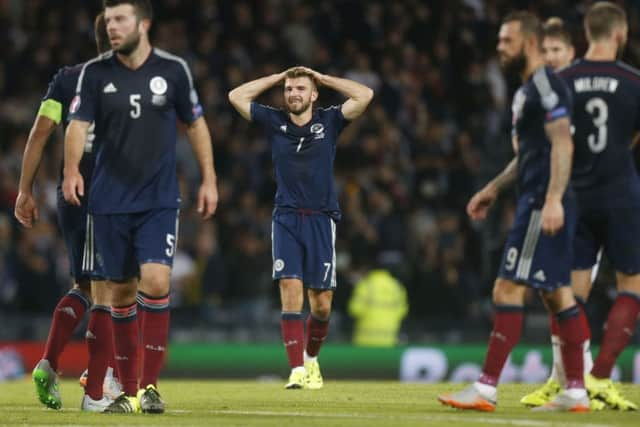 Dejection for James Morrison and Scotland after a narrow loss to Germany. Picture: PA